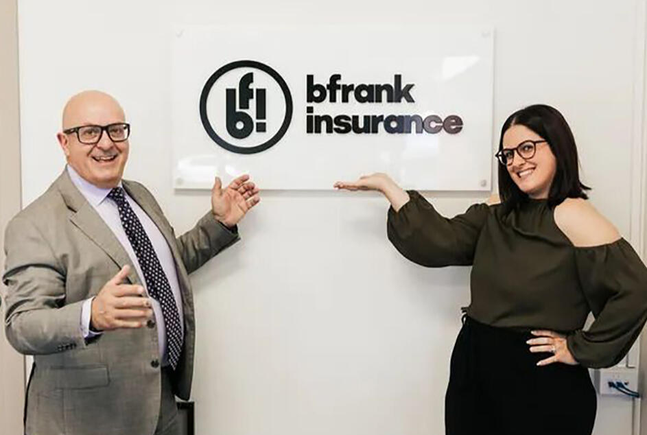 A modern office with professional insurance brokers engaged in a discussion, offering expert business insurance solutions for small businesses.